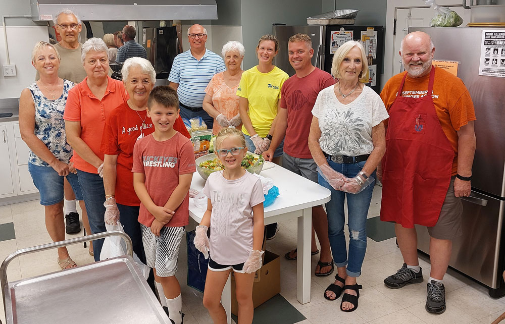 Church members serve spaghetti on the first Tuesday of the month