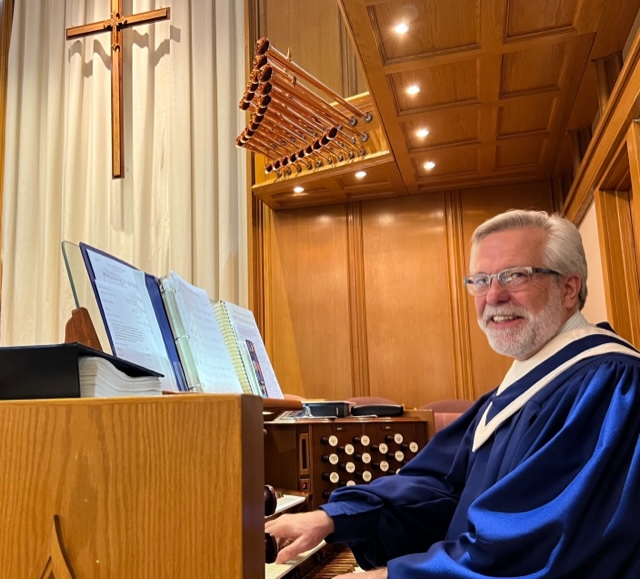 Lewis_Kim Kim Lewis, Director of Music, sitting at the church organ